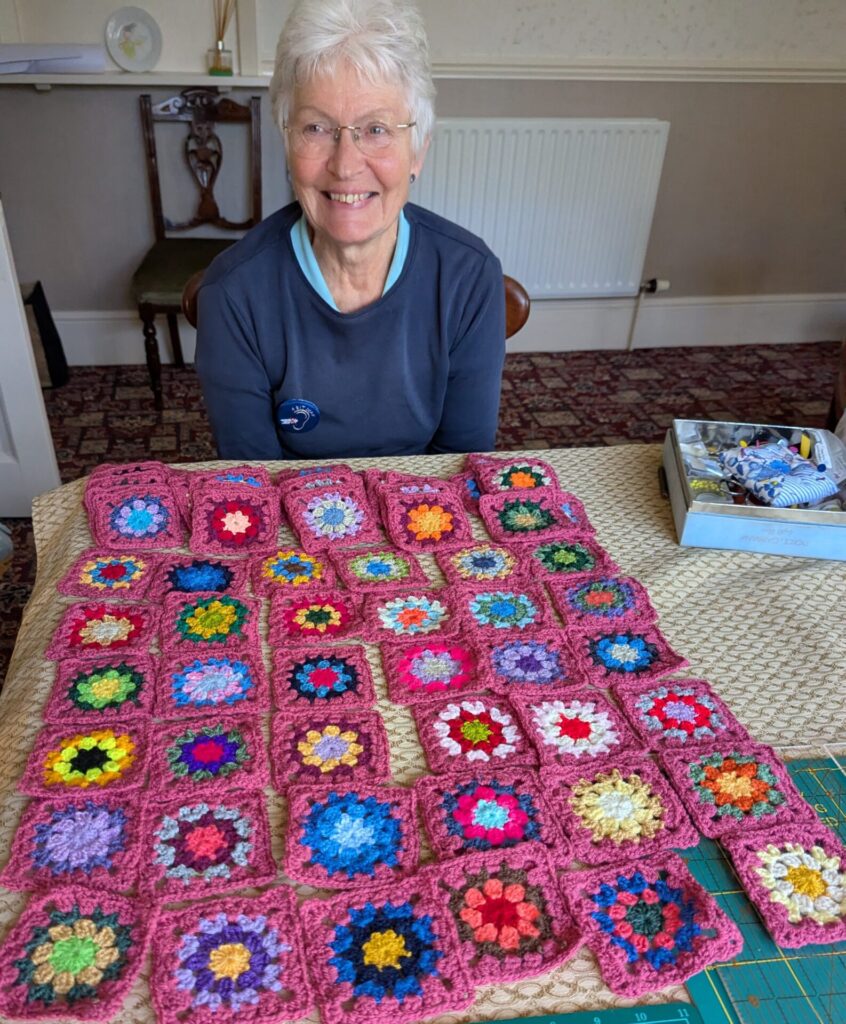 Pat with some of her granny squares
